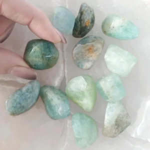 Aquamarine tumbled stone with soft blue tones. Supports calm communication, clarity, and emotional balance for meditation and daily use.