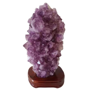 Amethyst cluster on wood