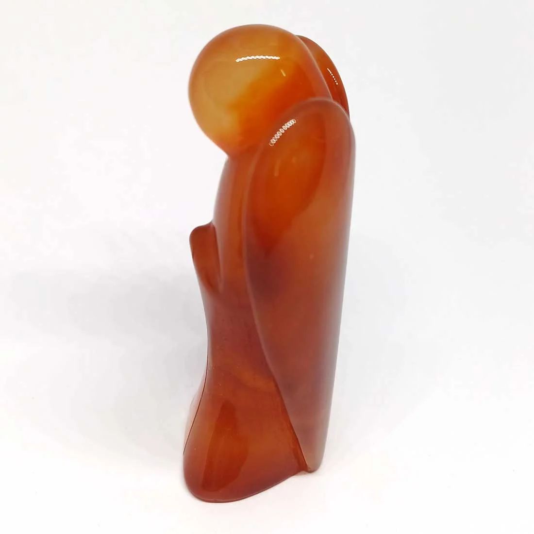 carved Angel figure made from vibrant orange Carnelian crystal