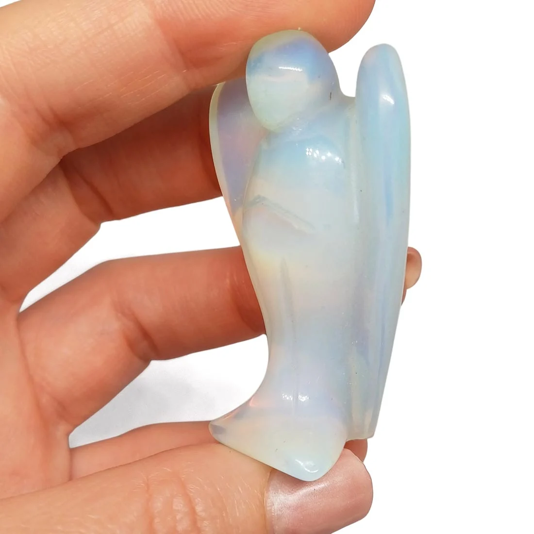 Carved Opal Glass Angel figurine with luminous, iridescent tones reflecting soft colors in light.