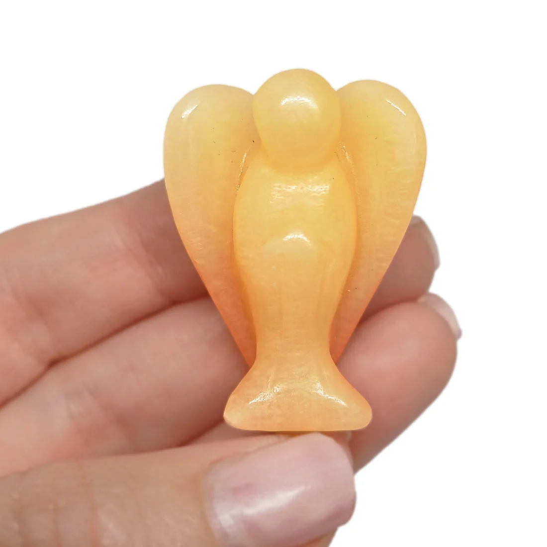 Carved Orange Calcite Angel figurine with smooth polished finish and glowing orange tones.