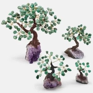 Crystal Trees of Life made with natural stones symbolizing growth, balance, and energy flow.