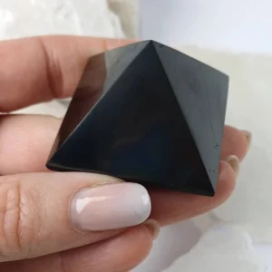 Shungite pyramid carved from natural black shungite stone