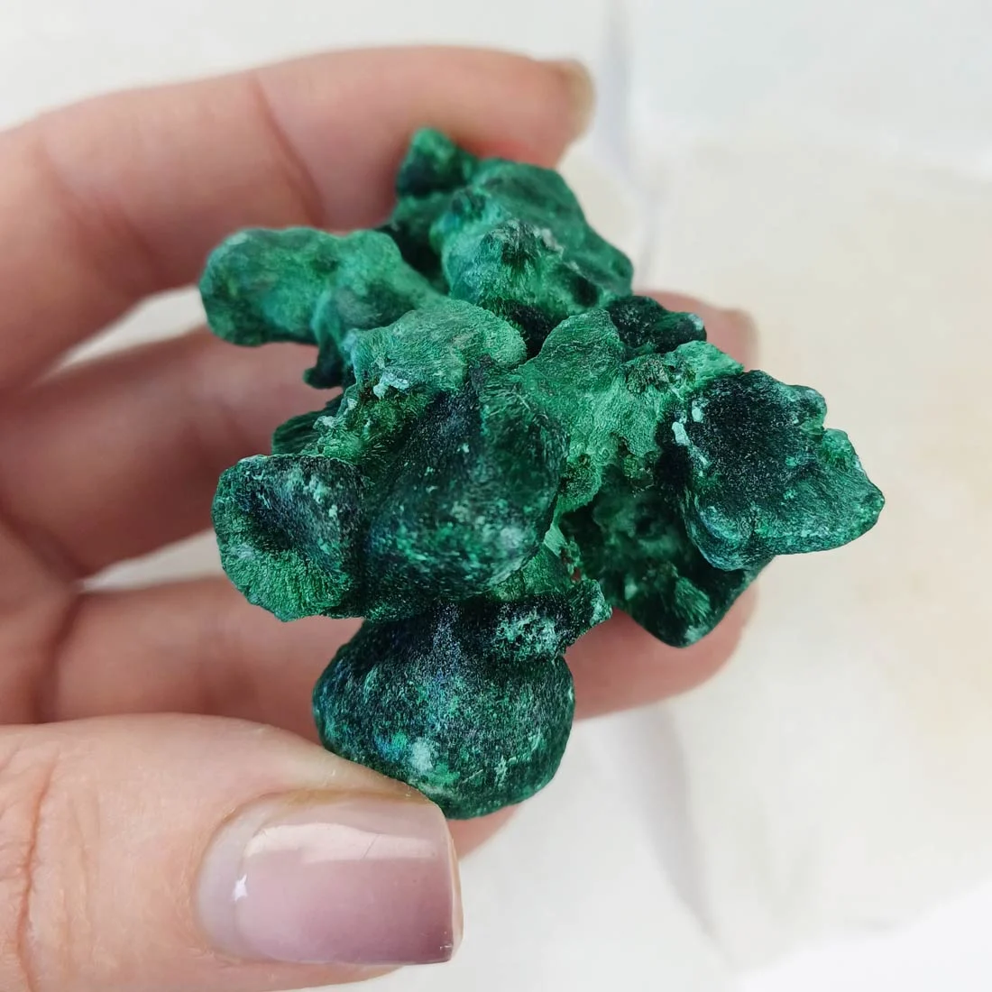 Fibrous malachite from Congo with deep green banding. A copper carbonate crystal formed in natural deposits