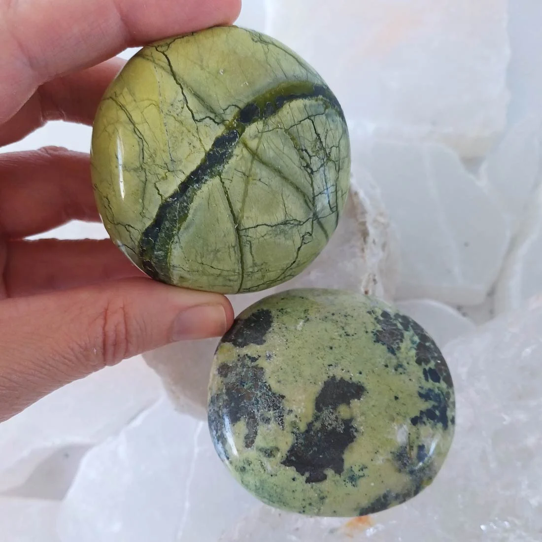 Polished Serpentine palm stone from Peru with natural green colour variations and mottled mineral patterns