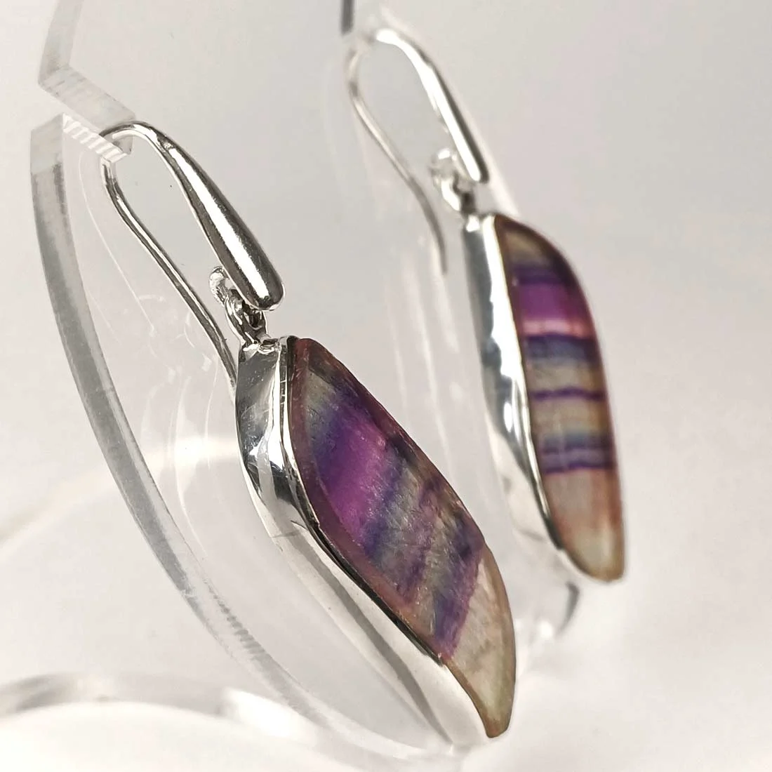 Sterling silver earrings with natural fluorite shaped as butterfly wings in green and purple tones.