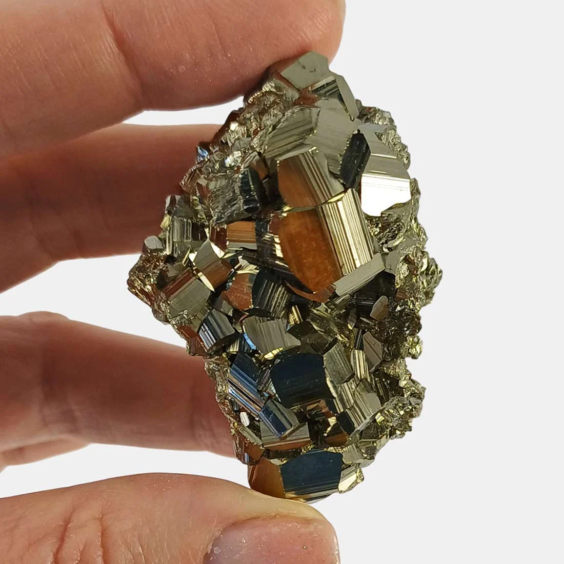 Pyrite crystal with large natural formations, metallic surface, and cubic growth patterns.