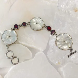 White shell blossoms and garnet silver bracelet