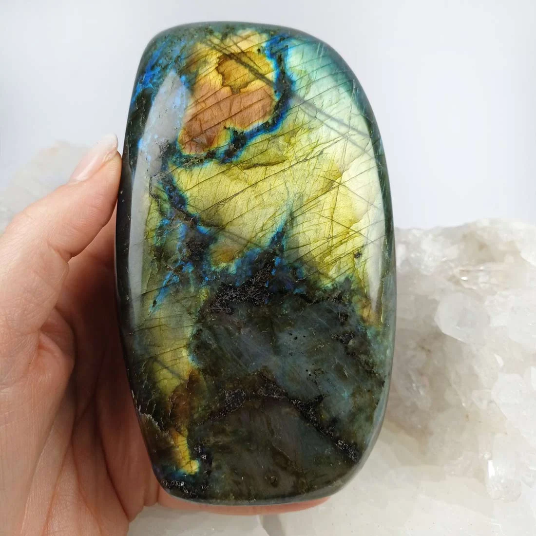 This polished labradorite stone is a feldspar rock known for its natural labradorescence and layered internal structure. Each piece displays unique color flashes when viewed under light.