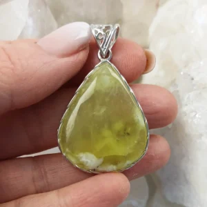 Large drop-shaped Prehnite pendant set in 925 sterling silver with soft green translucency.
