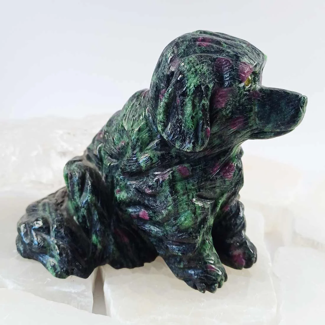 Ruby in Zoisite dog carving with natural ruby inclusions in green zoisite.