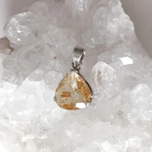 Rutilated Quartz drop pendant in 925 sterling silver. Each piece shows unique golden rutile inclusions.