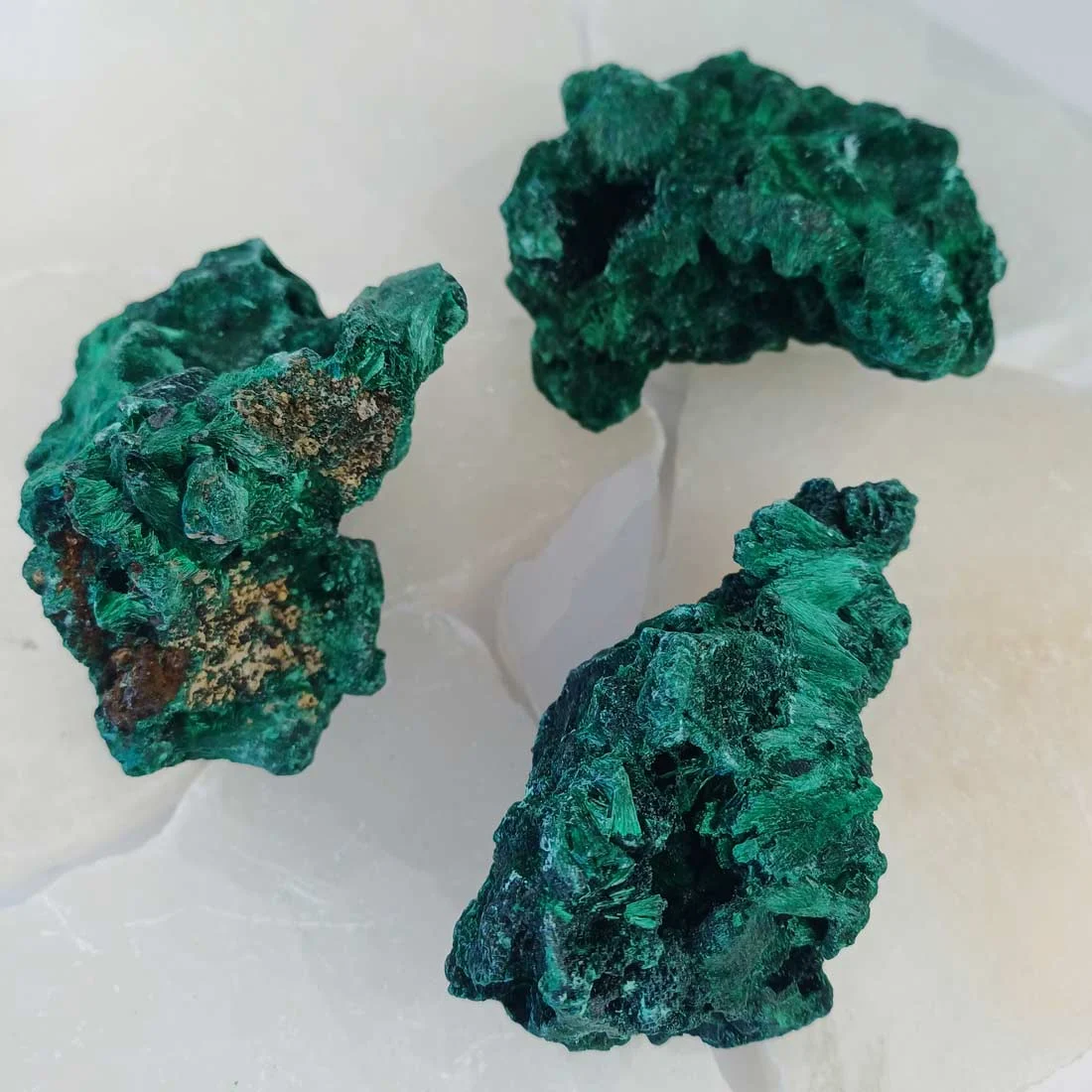 Fibrous malachite from Congo with deep green banding. A copper carbonate crystal formed in natural deposits, valued for its structure and geological origin.