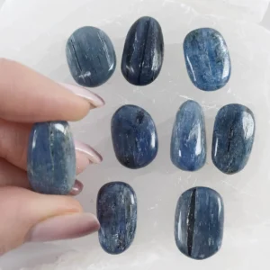 Polished blue Kyanite tumbled stone with natural deep blue tones and smooth finish, crystal for clarity and communication.