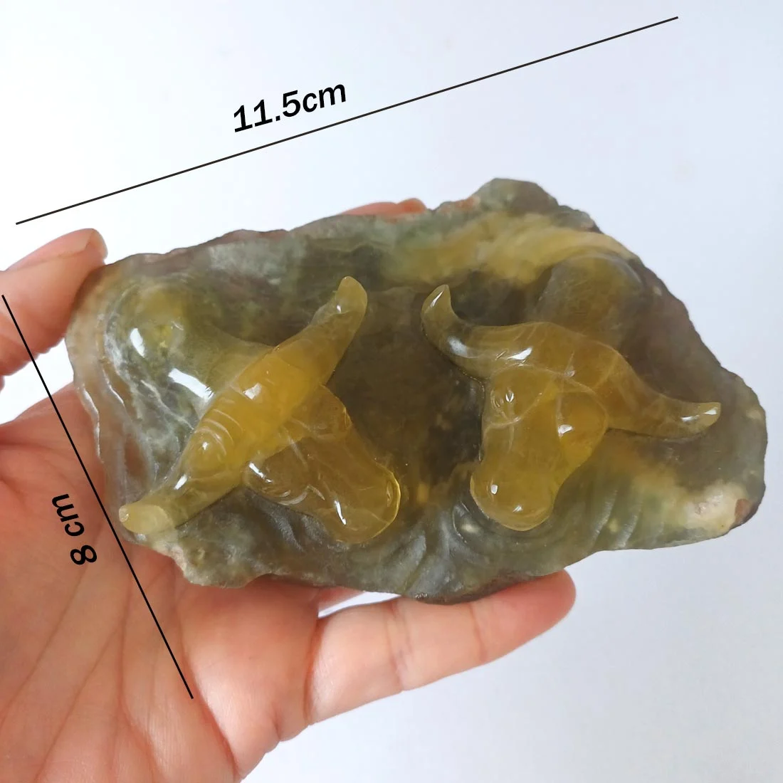 Fluorite Oxen carving, a palm-sized piece