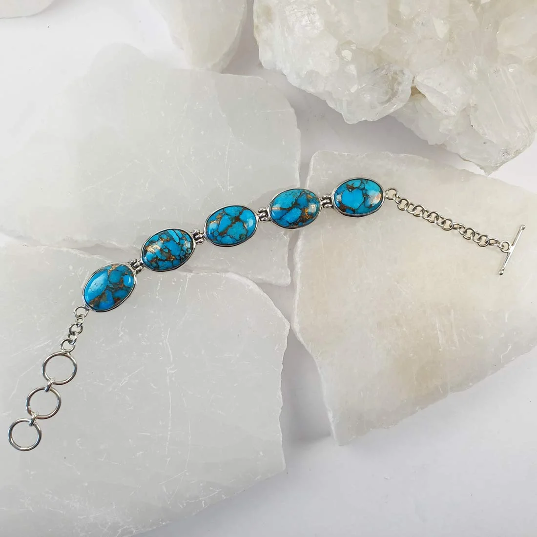 Turquoise with copper bracelet made with natural stone set in 925 sterling silver. A wearable piece combining mineral character with simple metalwork.