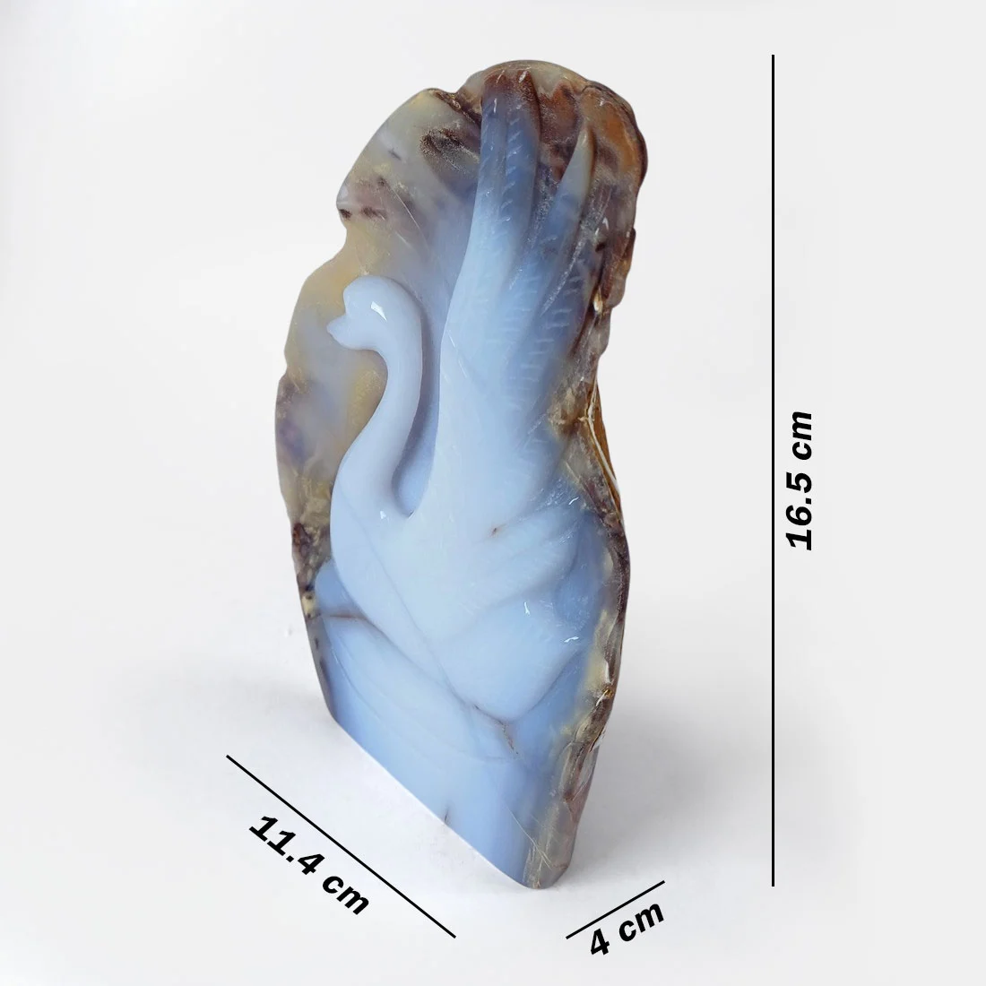 Swan carved from natural chalcedony slice, combining raw outer stone with a smooth inner crystal form.