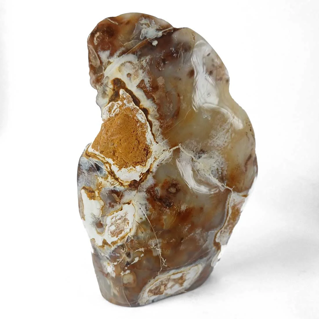 Carved chalcedony swan on a natural crystal slice with earthy outer texture and soft blue-white interior. Symbol of balance and loyalty - back side