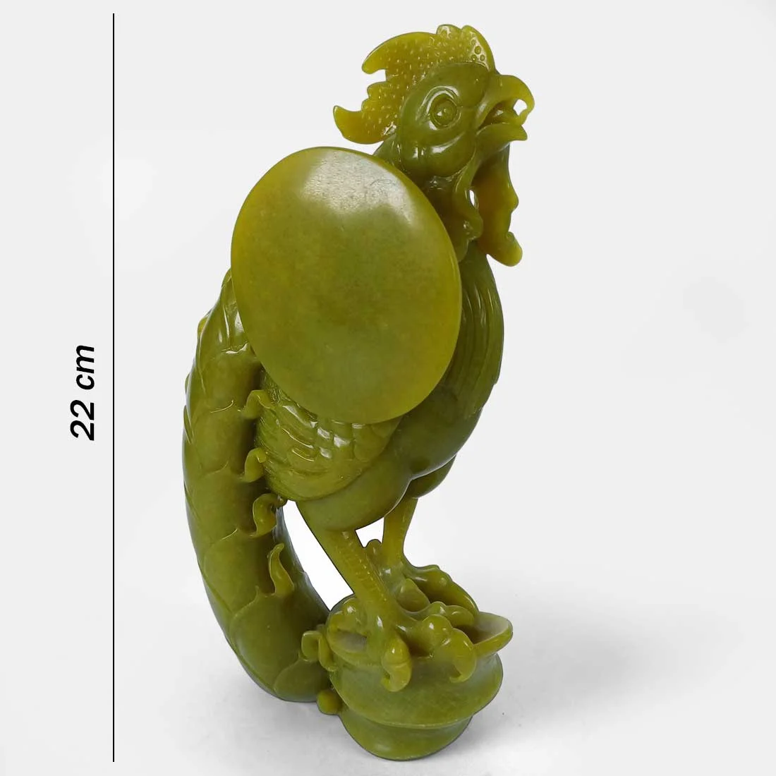 Museum quality hand-carved serpentine rooster sculpture with intricate feather detailing and polished yellow-green stone finish.