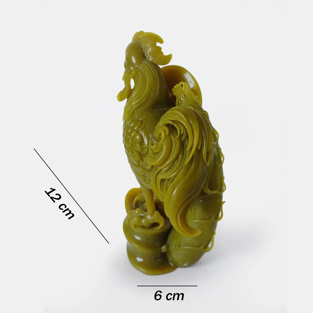 Museum quality serpentine rooster carving with detailed feather work and polished natural stone surface.