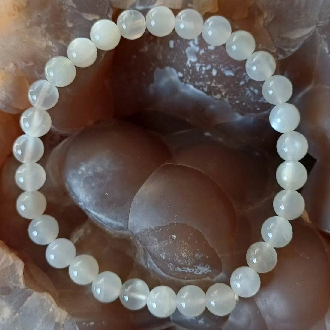 Natural White Moonstone bracelet with polished round crystal beads on elastic cord