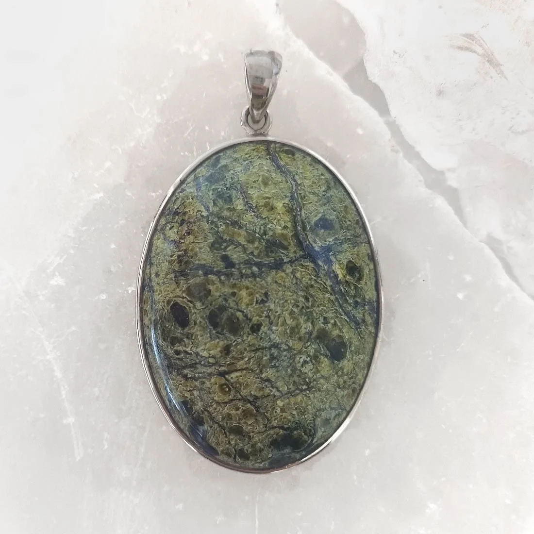 Polished Serpentine oval pendant set in 925 sterling silver with natural green colour variations